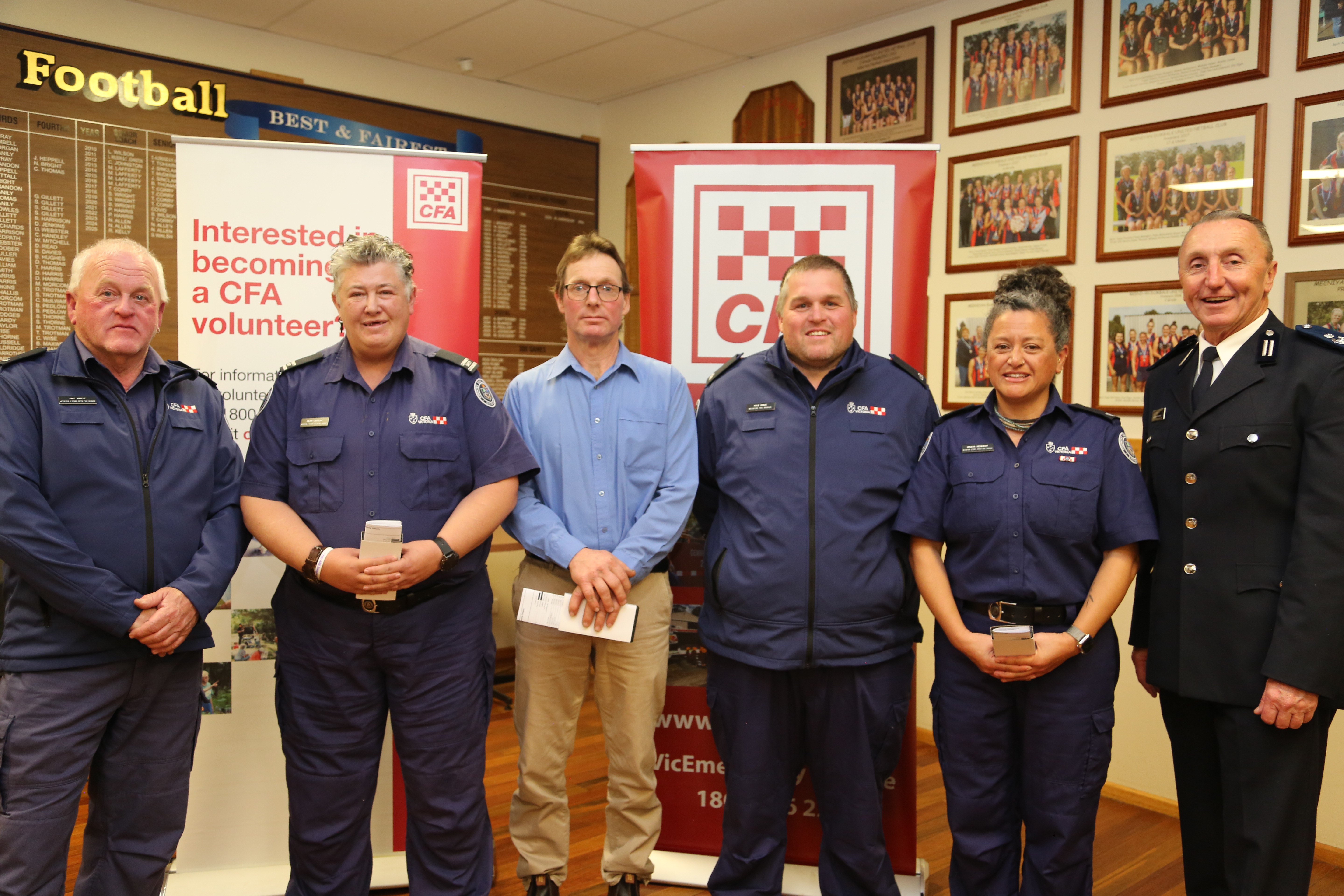 Captain Mal Price presented Meeniyan-Stony Creek members Sean Carson, Doug Webb, Kyle Price and Iznaya Kennedy with their service medals alongside Commander Andrew McCartney.